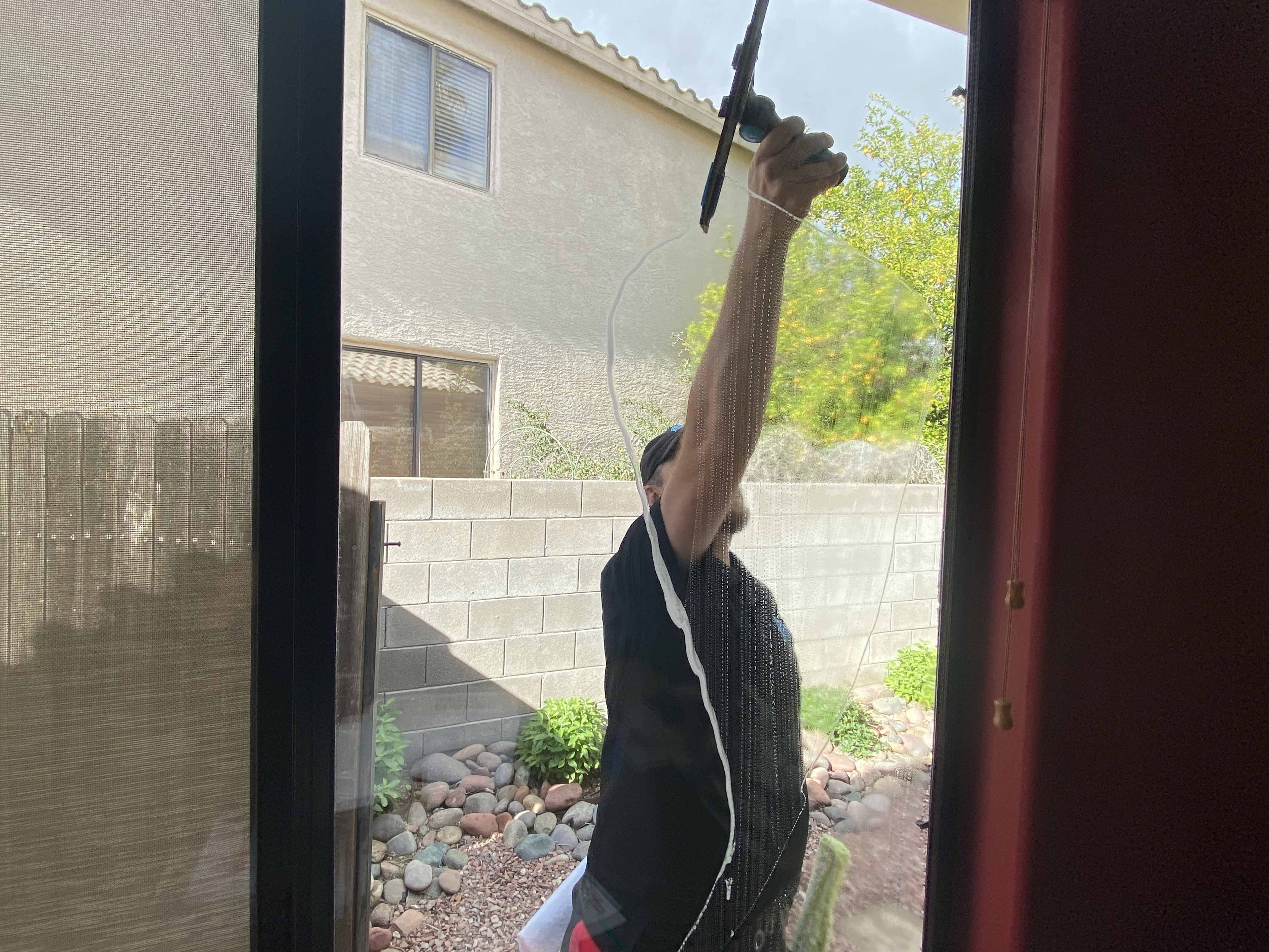 Using squeegee on window